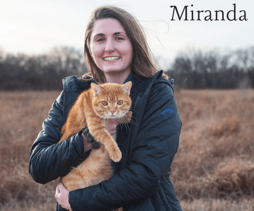 Miranda holding her orange kitty